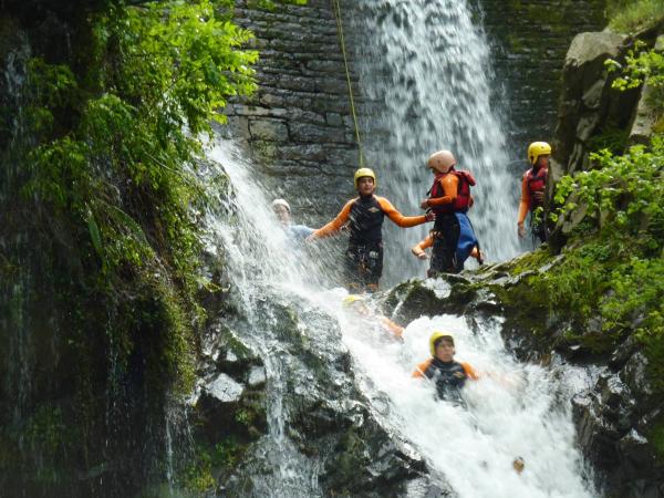 A group practices canyoning